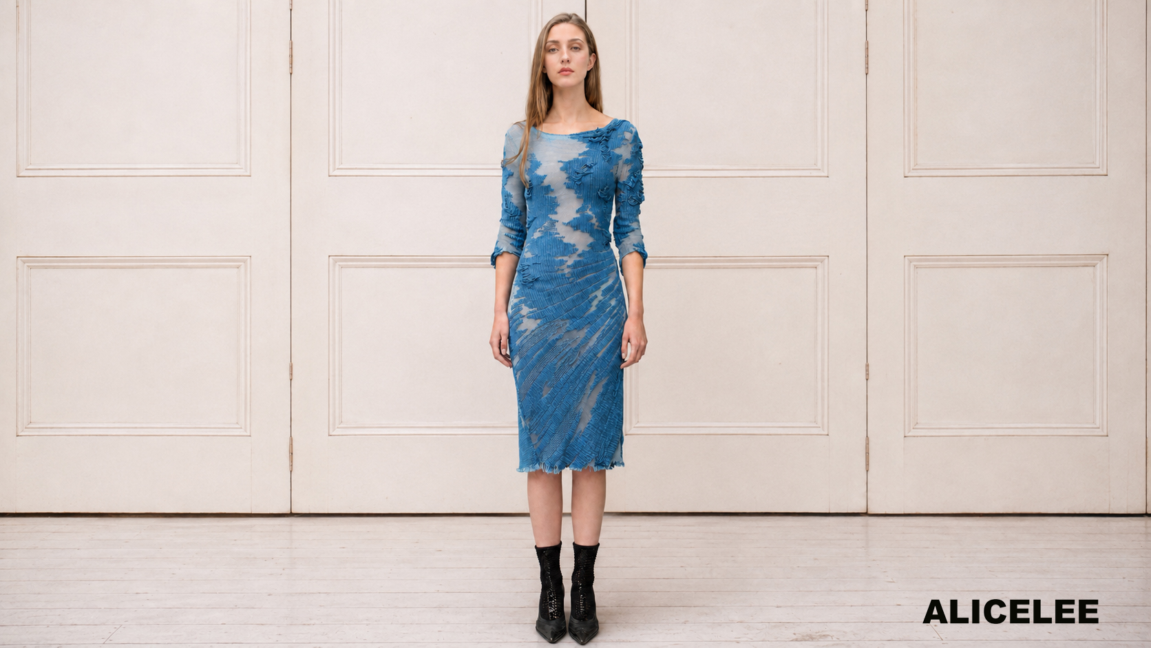 Alice Lee — blue denim-effect dress against cream doors